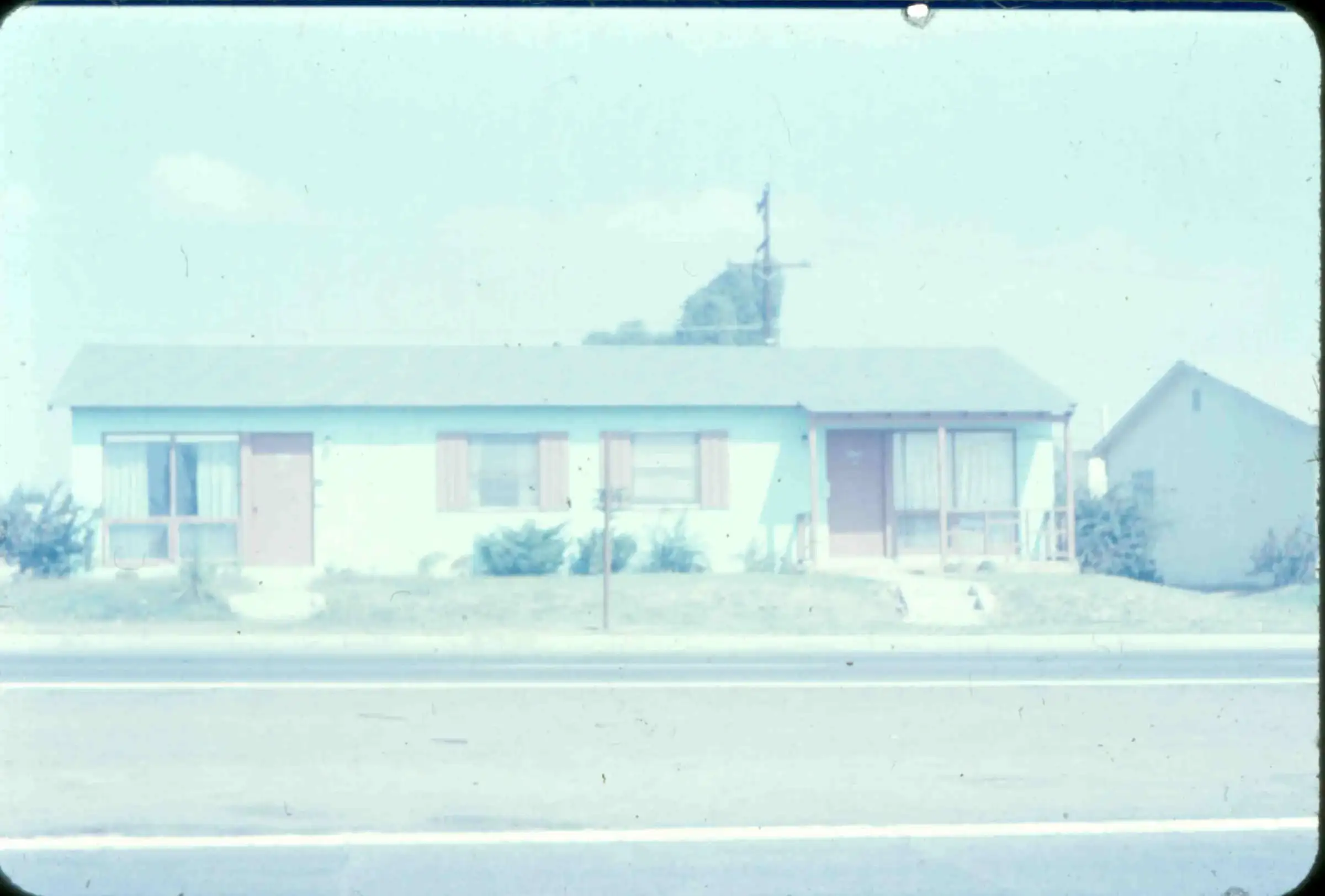 A small 1950s duplex home on a quiet Clairemont street