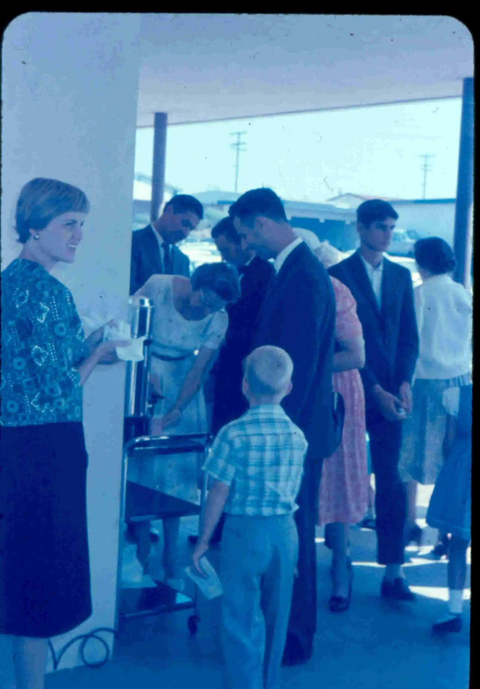 Church members chatting in the doorway after a Sunday service in 1962