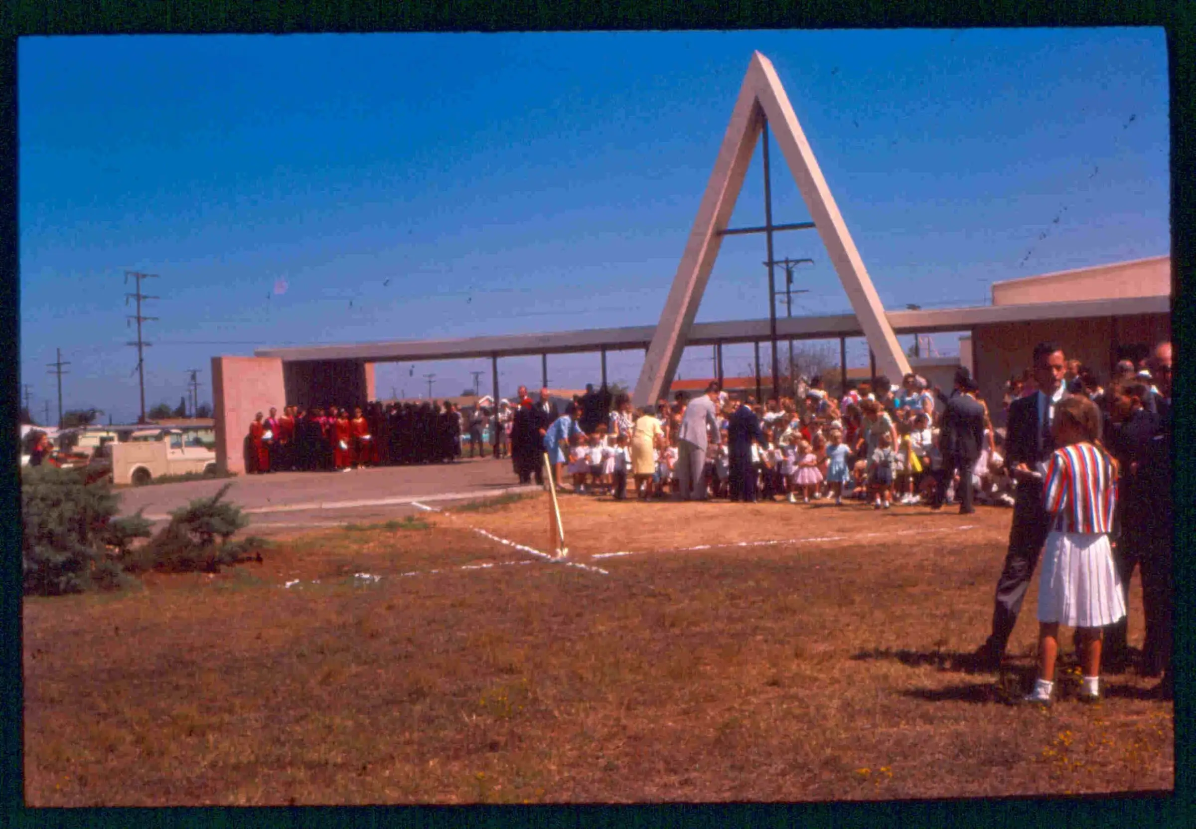 A crowd gathers beneath the church’s tall A-frame marker for the sanctuary ground breaking in July 1964