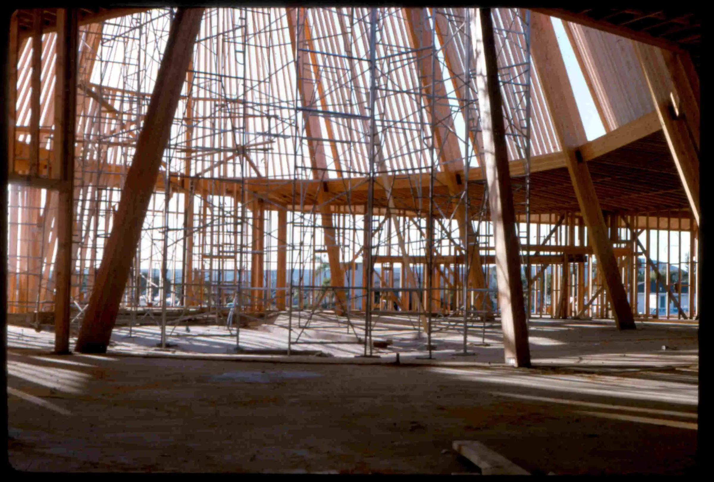 The sanctuary’s steep, tent-like timber frame rising against a blue sky in 1964