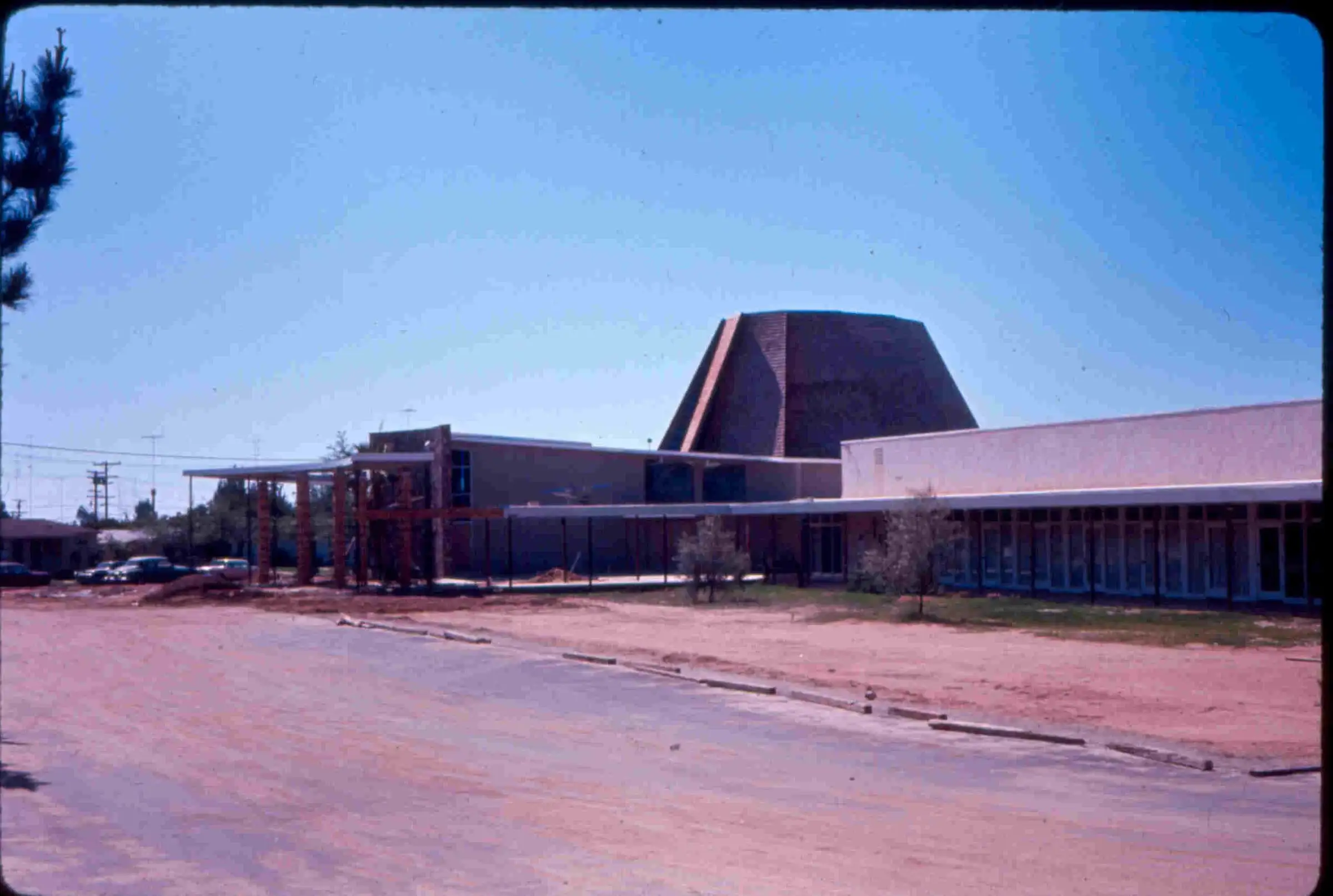 The finished mid-century sanctuary with its dark pyramidal roof